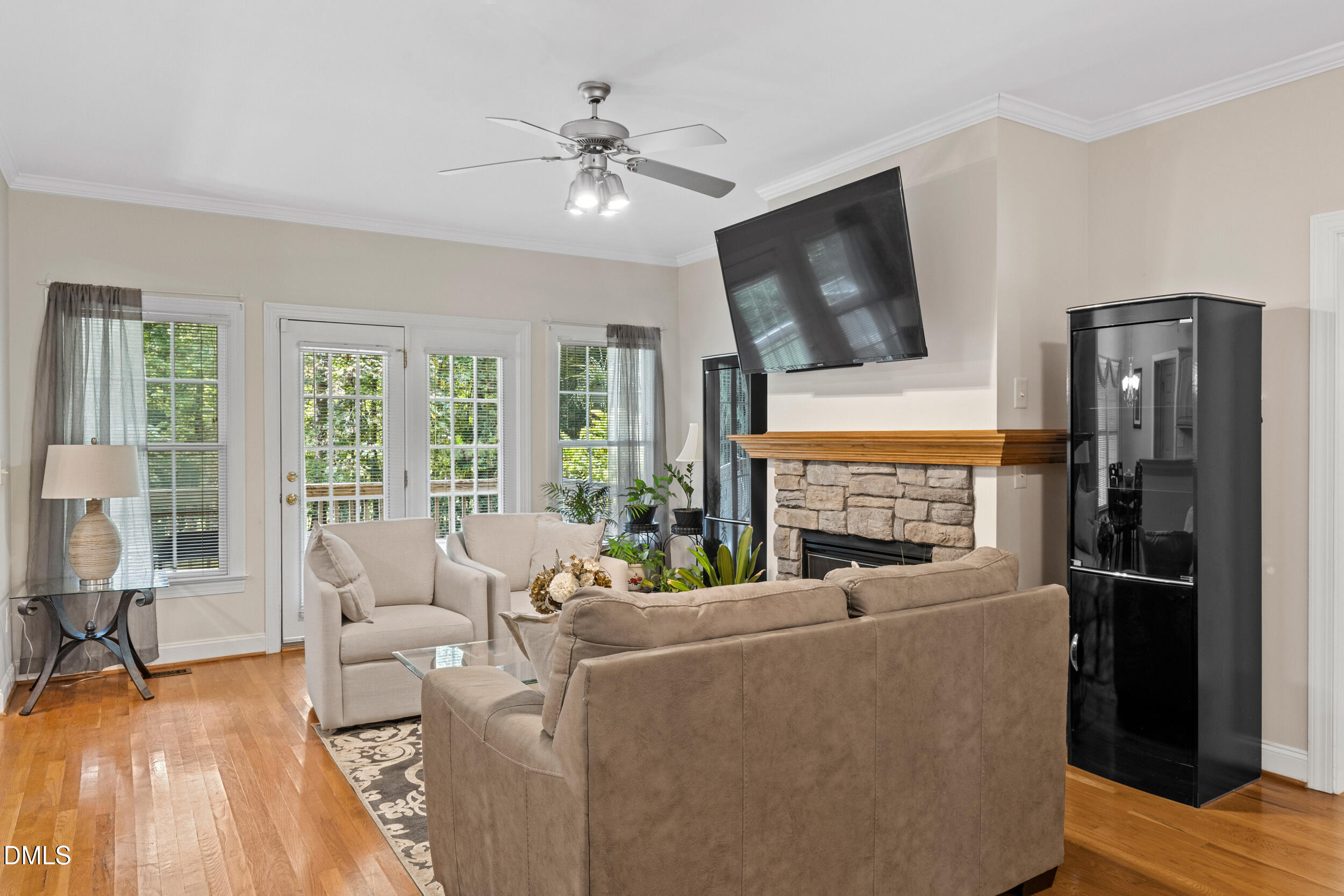 7619 Whitaker Drive Summerfield, NC 27358 - Photo 8 of 25 a living room with furniture fireplace and flat screen tv