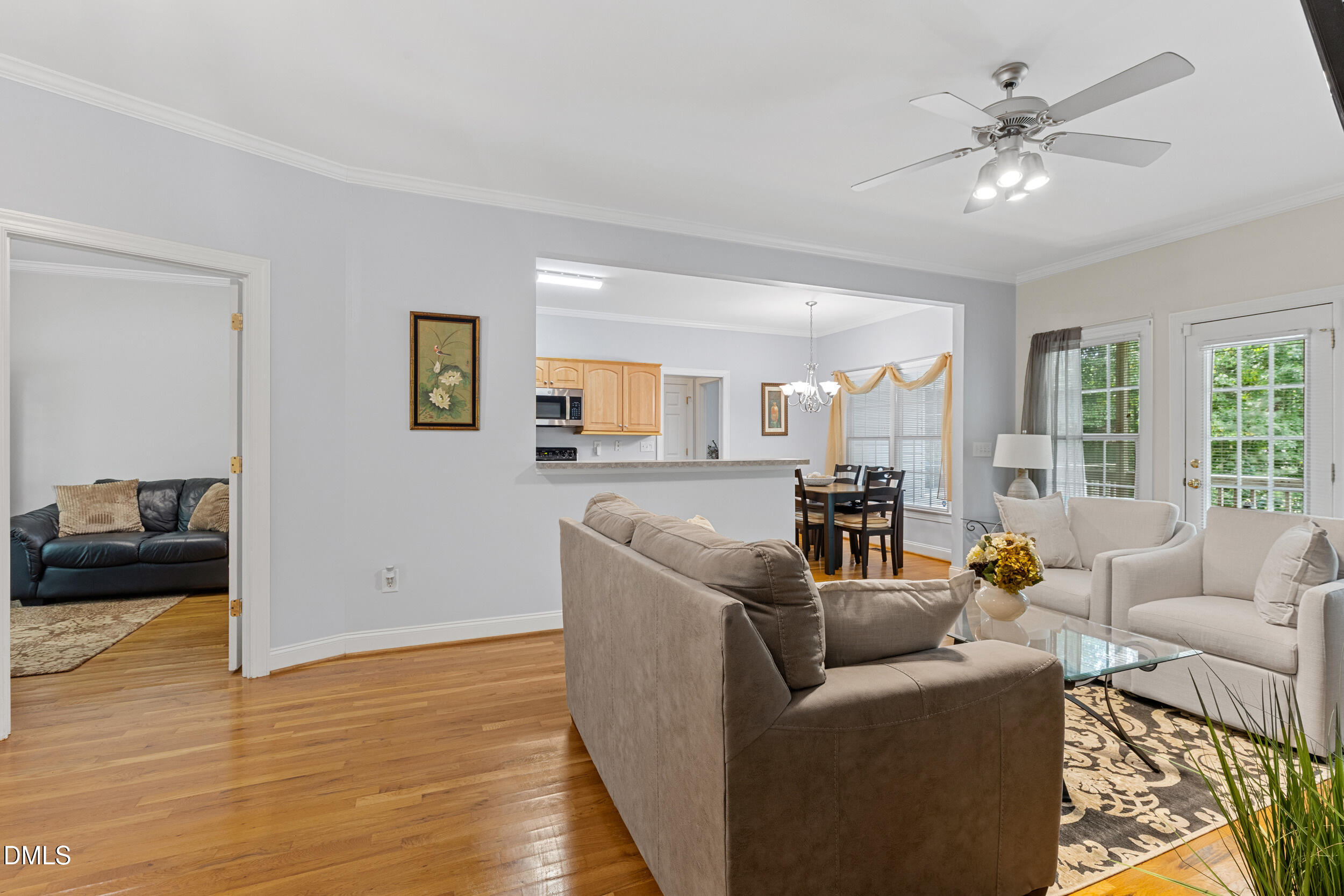 7619 Whitaker Drive Summerfield, NC 27358 - Photo 10 of 25 a living room with furniture and a large window