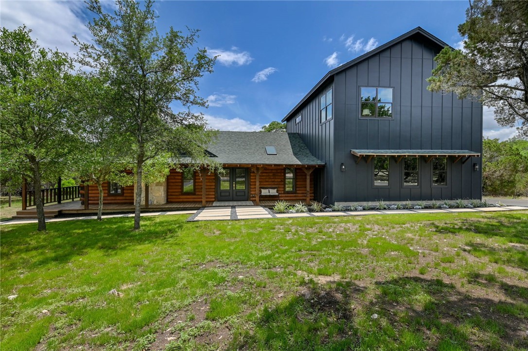 a front view of a house with a yard patio and fire pit