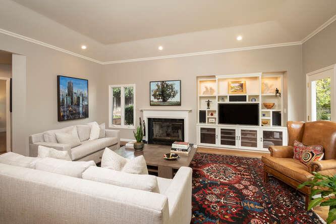 840 Longview Road Hillsborough, CA 94010 - Photo 11 of 49 a living room with furniture a flat screen tv and a fireplace