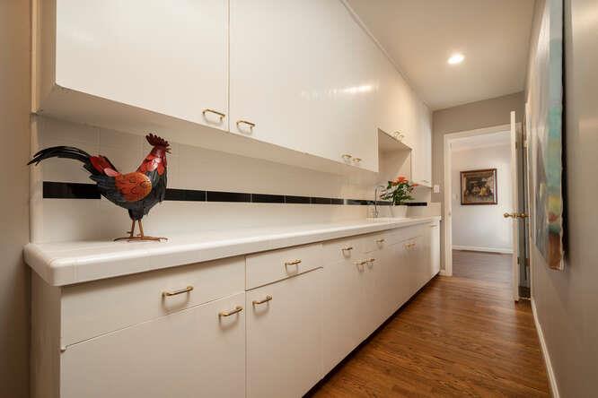 840 Longview Road Hillsborough, CA 94010 - Photo 13 of 49 a kitchen with a sink and refrigerator