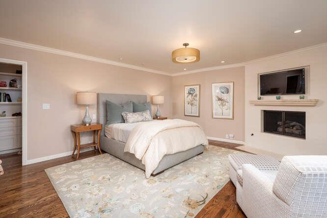 840 Longview Road Hillsborough, CA 94010 - Photo 15 of 49 a spacious bedroom with a bed and a flat screen tv