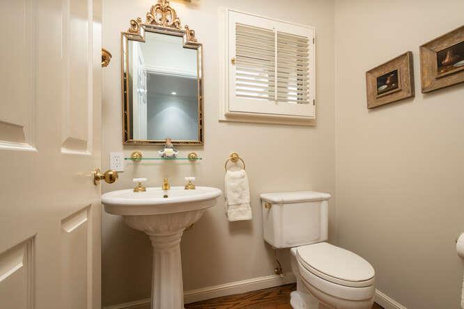 840 Longview Road Hillsborough, CA 94010 - Photo 20 of 49 a bathroom with a toilet sink and mirror
