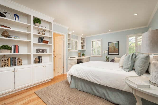 840 Longview Road Hillsborough, CA 94010 - Photo 21 of 49 a bedroom with a bed and a book shelf