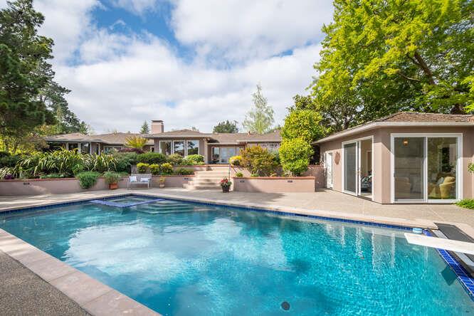 840 Longview Road Hillsborough, CA 94010 - Photo 31 of 49 a house view with swimming pool and garden space