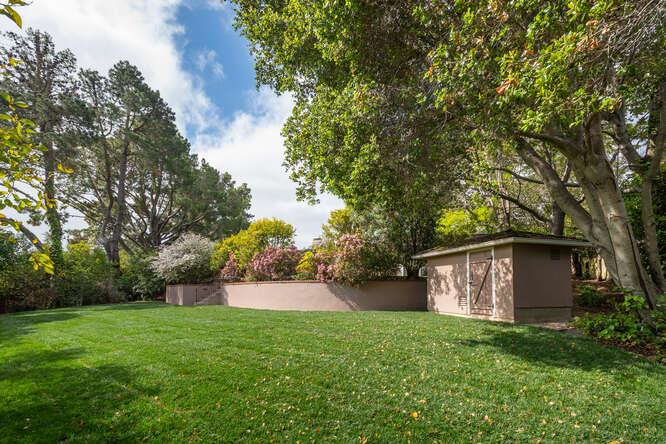 840 Longview Road Hillsborough, CA 94010 - Photo 32 of 49 a view of a backyard with large trees and plants