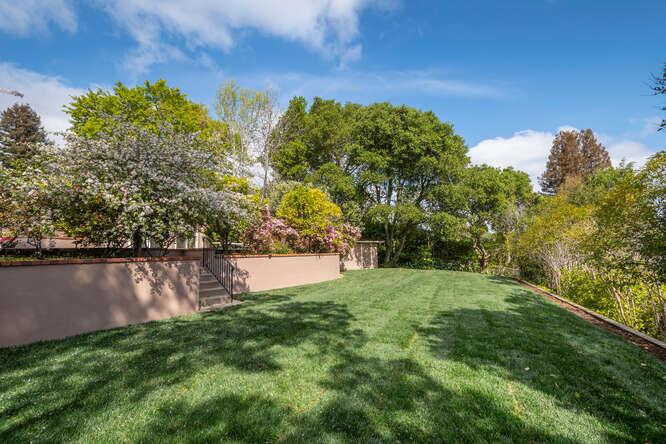 840 Longview Road Hillsborough, CA 94010 - Photo 33 of 49 a view of a yard with a tree in the background