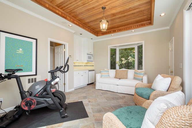 840 Longview Road Hillsborough, CA 94010 - Photo 40 of 49 a living room with furniture a window and gym equipment