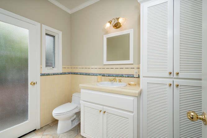 840 Longview Road Hillsborough, CA 94010 - Photo 41 of 49 a bathroom with a toilet sink and mirror