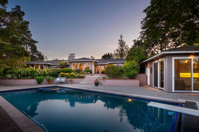 840 Longview Road Hillsborough, CA 94010 - Photo 43 of 49 a view of a lake with couches in front of house
