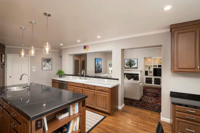 840 Longview Road Hillsborough, CA 94010 - Photo 10 of 49 a kitchen with stainless steel appliances granite countertop a sink refrigerator and cabinets