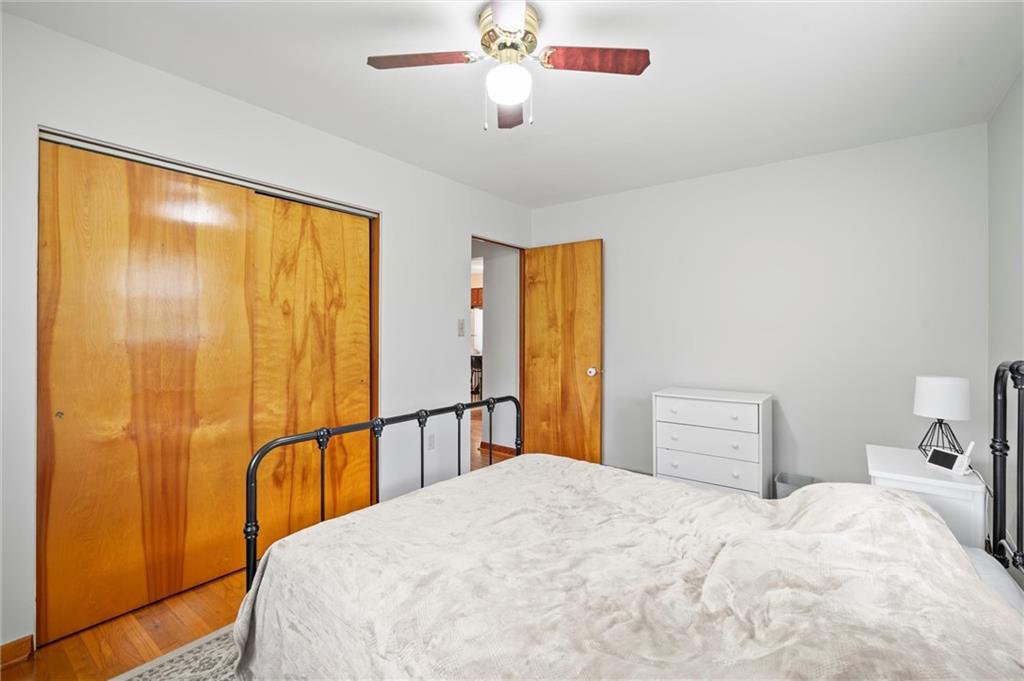 2184 Dime Road Vandergrift, PA 15690 - Photo 8 of 25 a bedroom with a bed and a chandelier