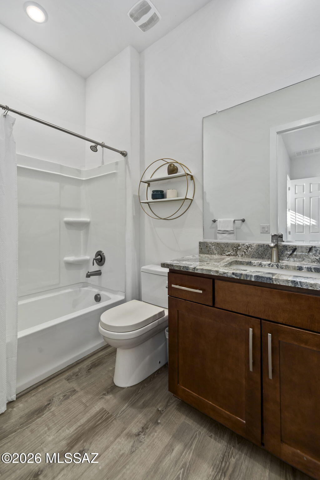 12791 East Tortoise Pointe Drive Vail, AZ 85641 - Photo 34 of 50 a bathroom with a granite countertop toilet sink and bathtub