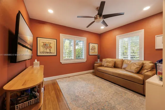 a living room with furniture and a window