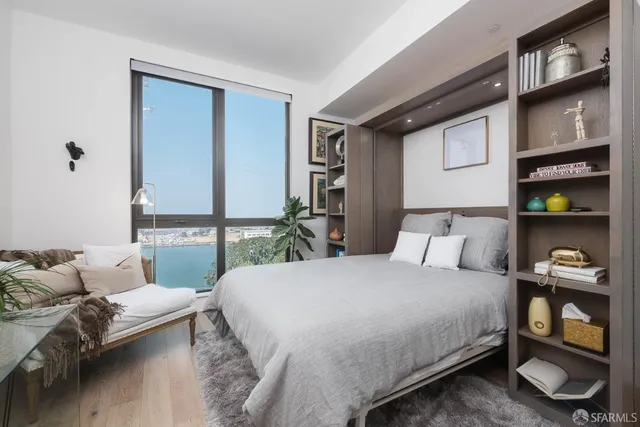 a bedroom with a bed and a dresser