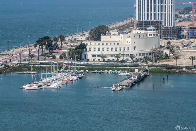 a living room with furniture and floor to ceiling windows