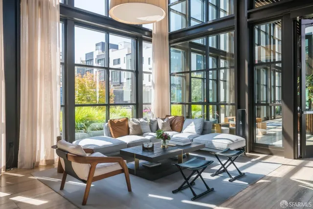 a front view of a residential apartment building with a yard