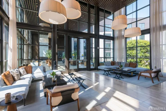 a kitchen with a wooden floor and a fireplace