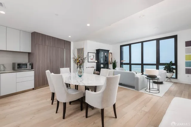 a view of a dining room with furniture window and outside view