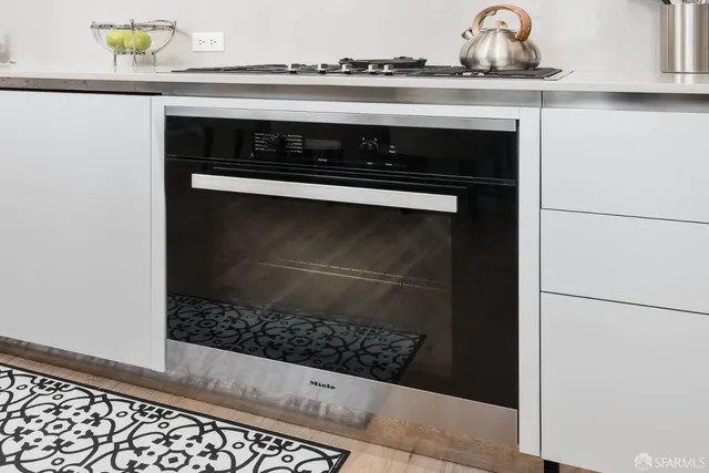 a close view of a stove a microwave and a sink