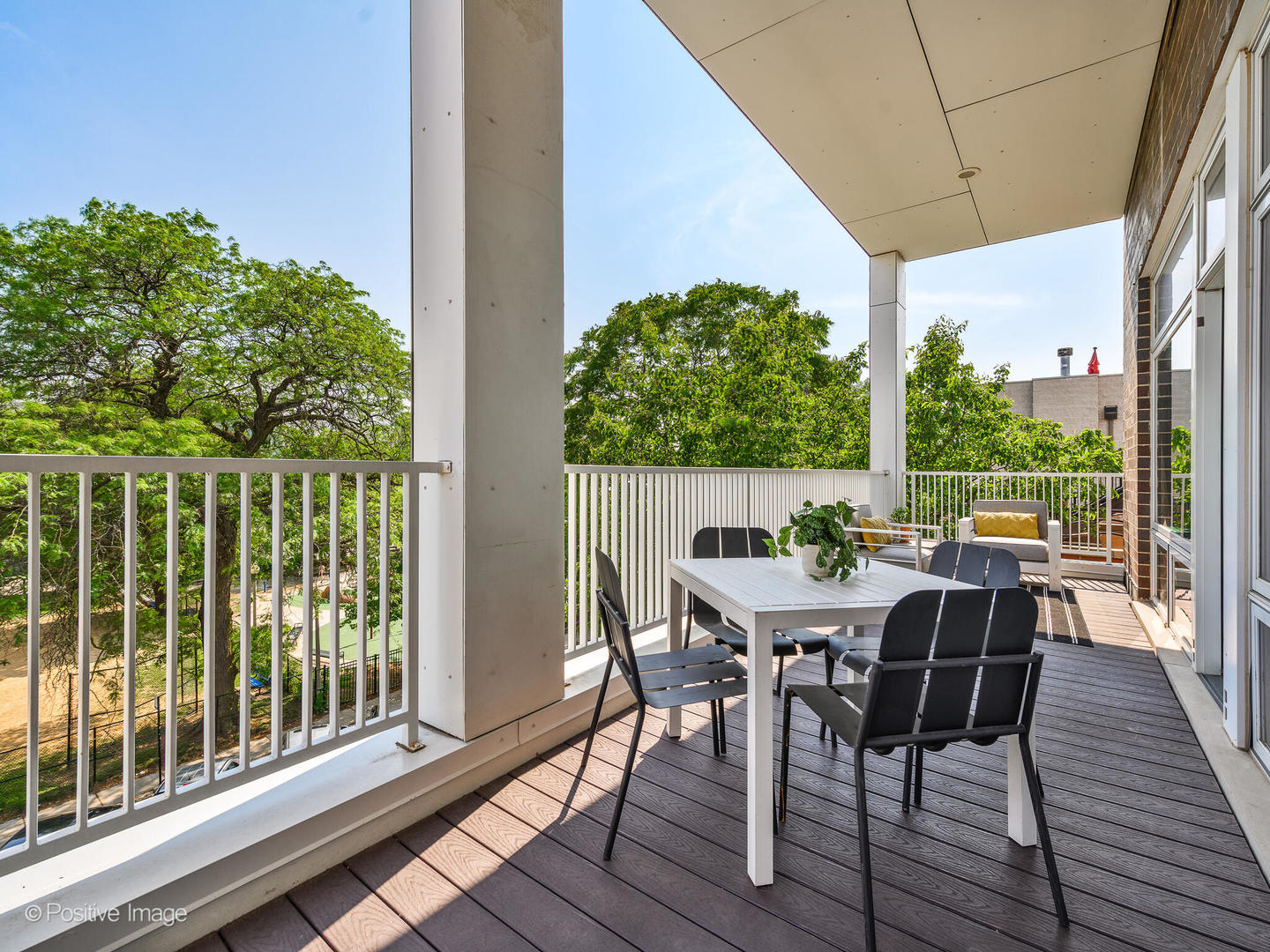 1832 West Rice Street, Unit 3 Chicago, IL 60622 - Photo 15 of 30 a view of a patio with table and chairs and wooden floor