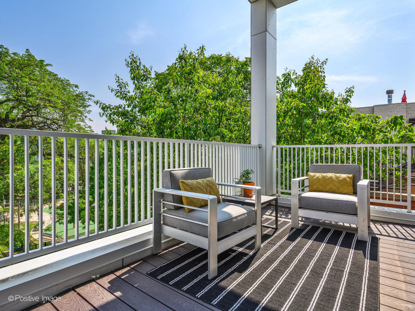 1832 West Rice Street, Unit 3 Chicago, IL 60622 - Photo 16 of 30 a view of a wooden deck with furniture