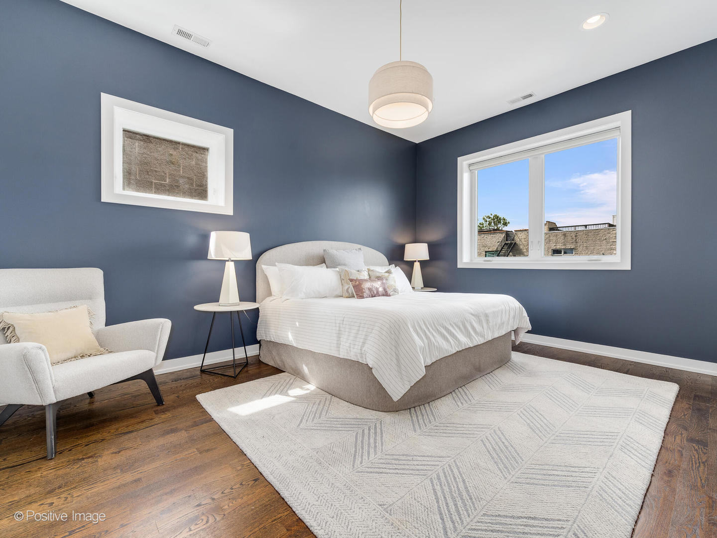 1832 West Rice Street, Unit 3 Chicago, IL 60622 - Photo 18 of 30 a bedroom with a large bed and a couch