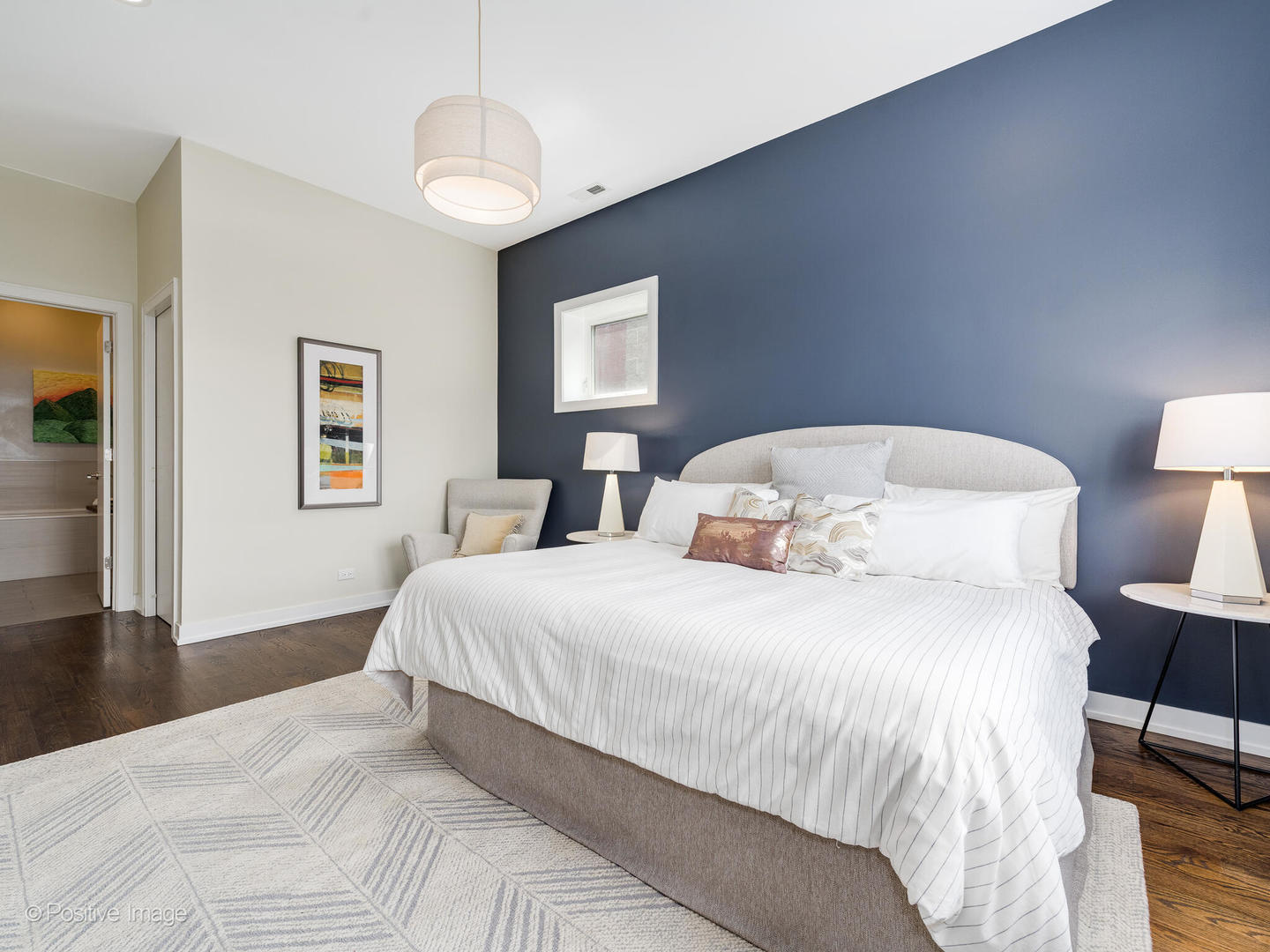 1832 West Rice Street, Unit 3 Chicago, IL 60622 - Photo 19 of 30 a bedroom with a bed and wooden floor