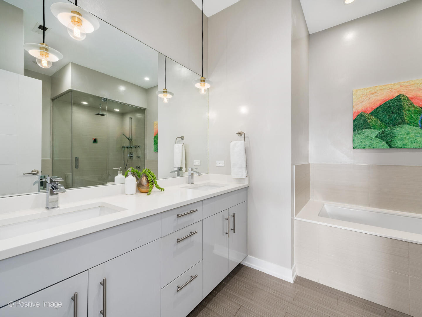 1832 West Rice Street, Unit 3 Chicago, IL 60622 - Photo 20 of 30 a bathroom with a sink double vanity granite tub and shower
