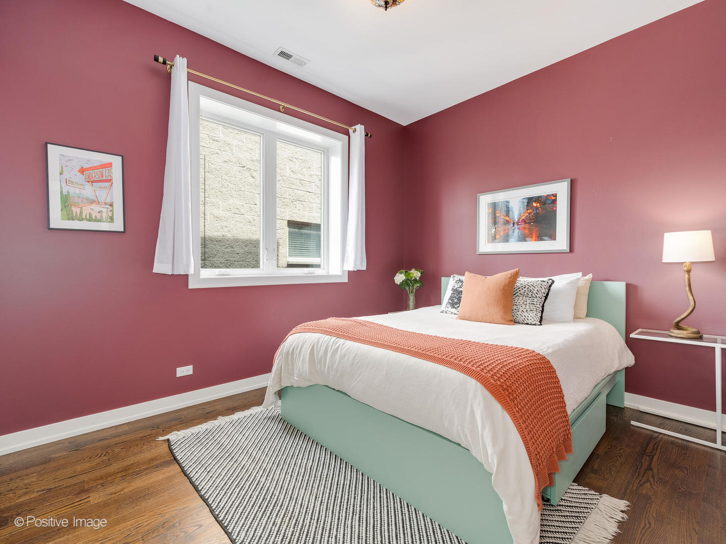 1832 West Rice Street, Unit 3 Chicago, IL 60622 - Photo 22 of 30 a bedroom with a bed and wooden floor