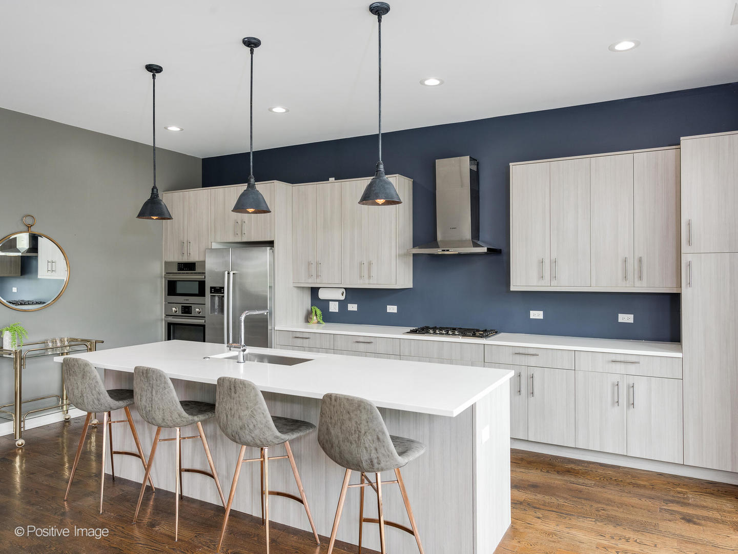 1832 West Rice Street, Unit 3 Chicago, IL 60622 - Photo 8 of 30 a kitchen with stainless steel appliances granite countertop a sink a stove a refrigerator and island with wooden floor
