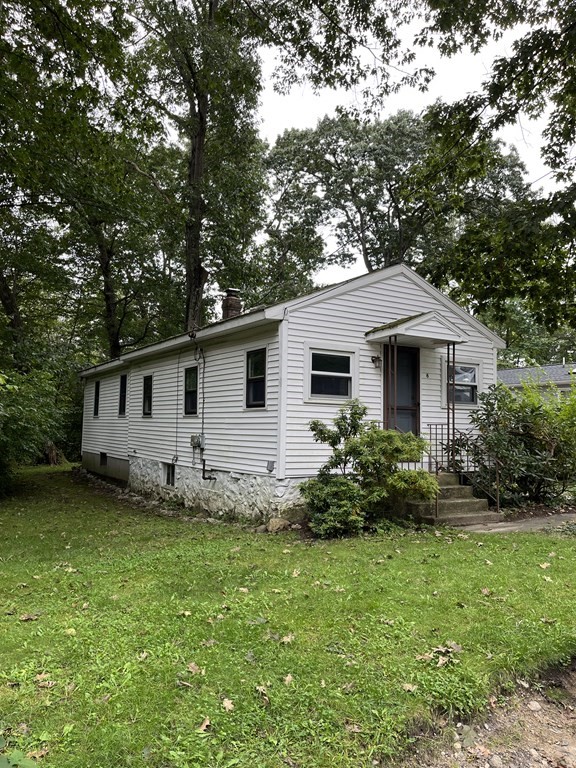 6 New Street Billerica, MA 01821 - Photo 2 of 17 a view of a house with a yard