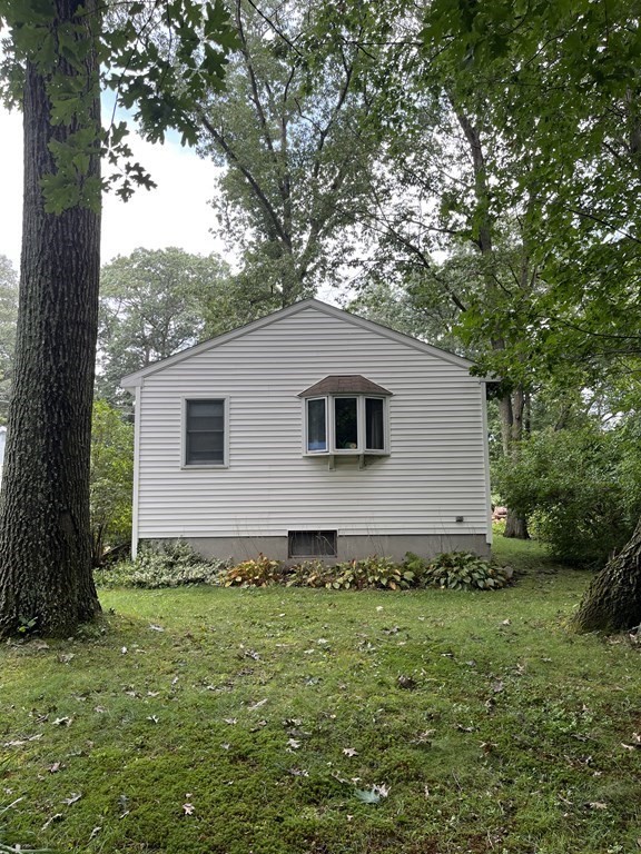 6 New Street Billerica, MA 01821 - Photo 4 of 17 a backyard of a house with lots of green space