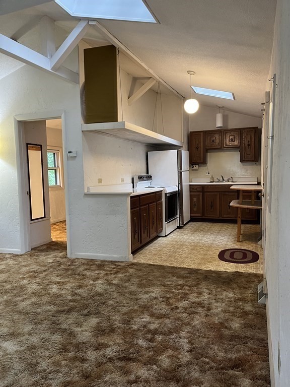 6 New Street Billerica, MA 01821 - Photo 6 of 17 a kitchen with stainless steel appliances granite countertop a stove and a sink