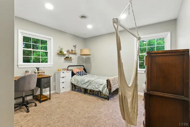a bedroom with furniture and a window