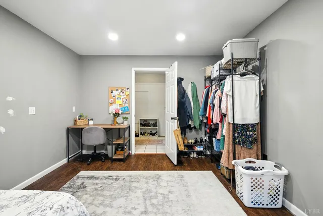 a living room with furniture a rug and a table