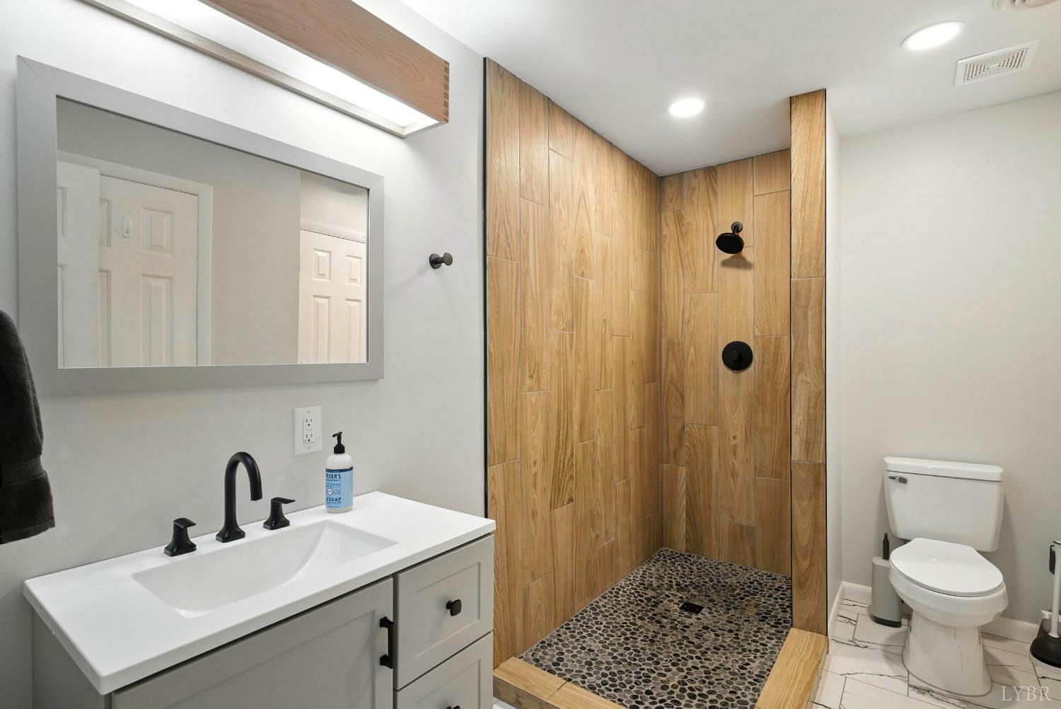 2078 Featherfin Road Prospect, VA 23960 - Photo 29 of 49 a bathroom with a sink a toilet and shower