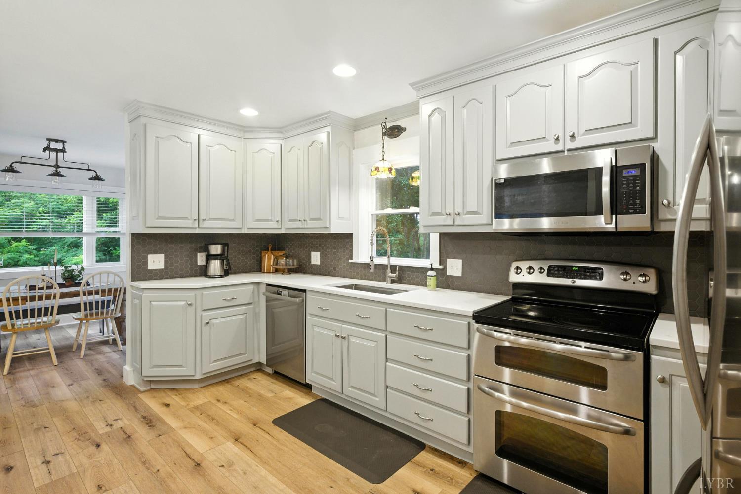 2078 Featherfin Road Prospect, VA 23960 - Photo 3 of 49 a kitchen with appliances a sink and cabinets