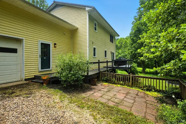 a view of balcony with deck and wooden floor