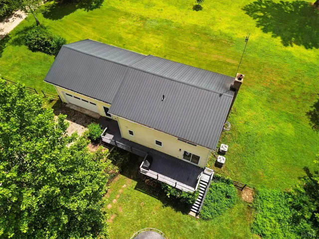 a aerial view of a house with a big yard