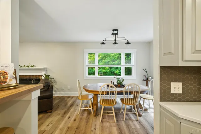 a dining room with furniture and window
