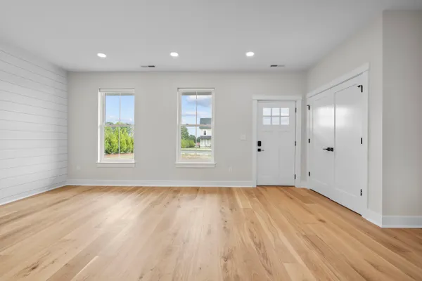 a view of room with window and hardwood floor