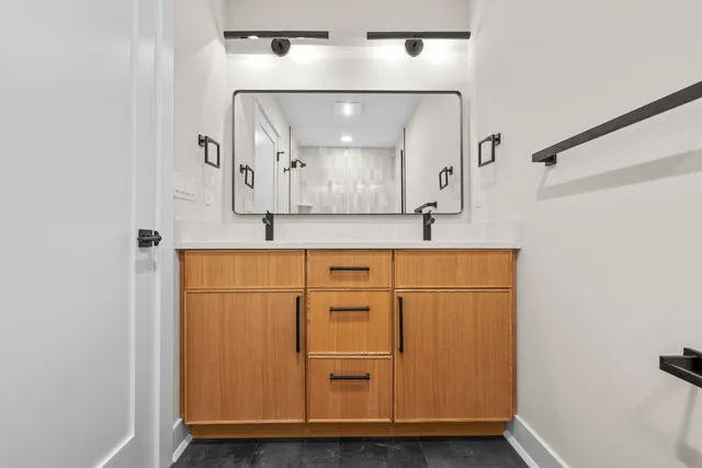 a bathroom with a sink and a mirror