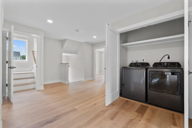 a kitchen with granite countertop a refrigerator and a sink