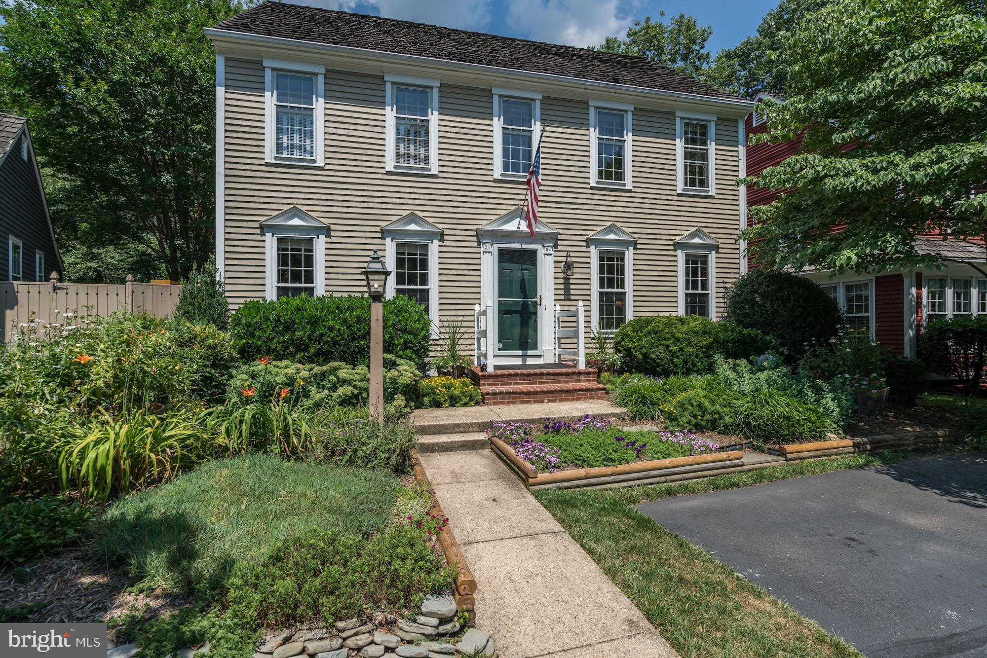 2104 Salt Kettle Way Reston, VA 20191 - Photo 1 of 29 a front view of a house with garden