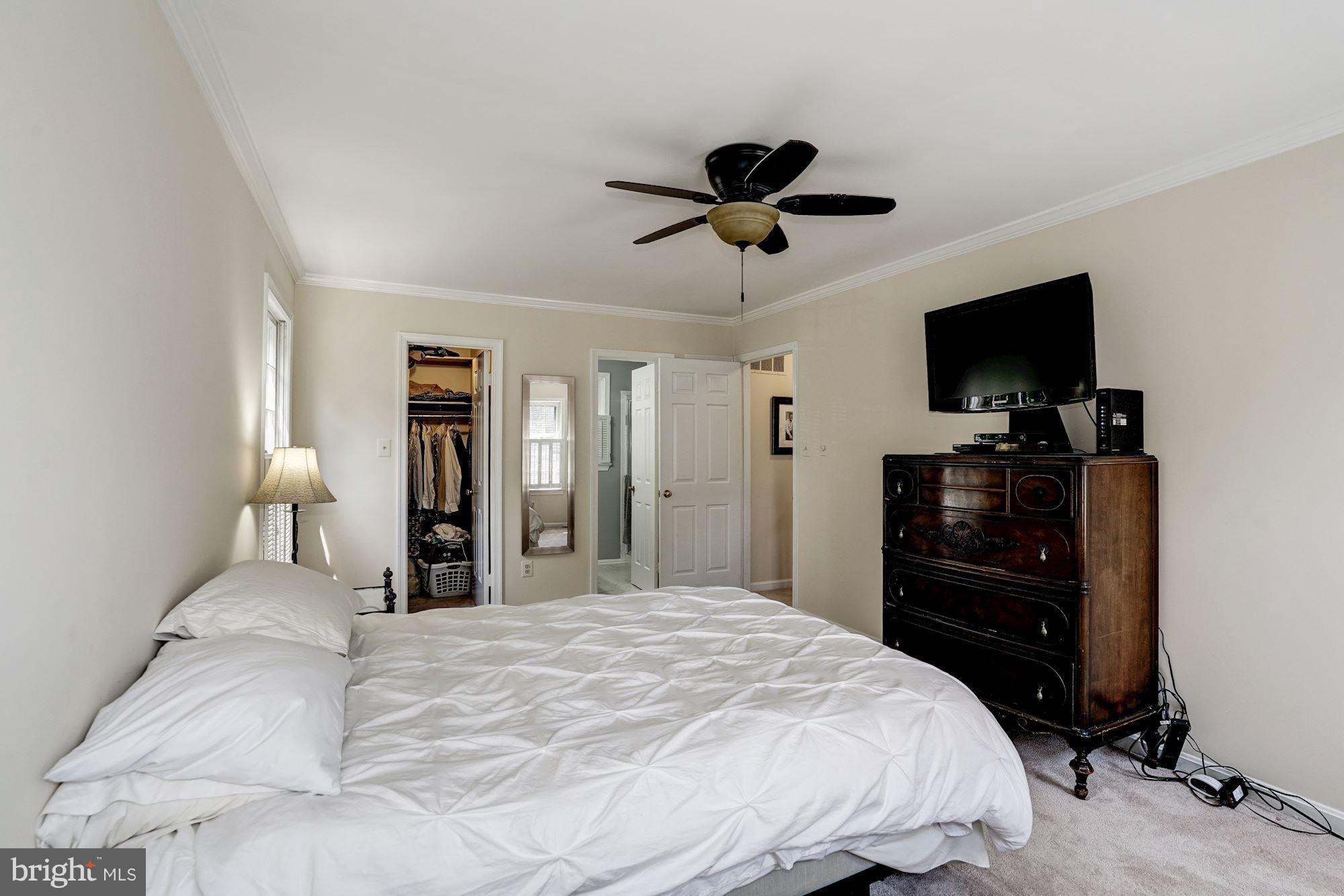 2104 Salt Kettle Way Reston, VA 20191 - Photo 13 of 29 a bedroom with a bed and a flat screen tv