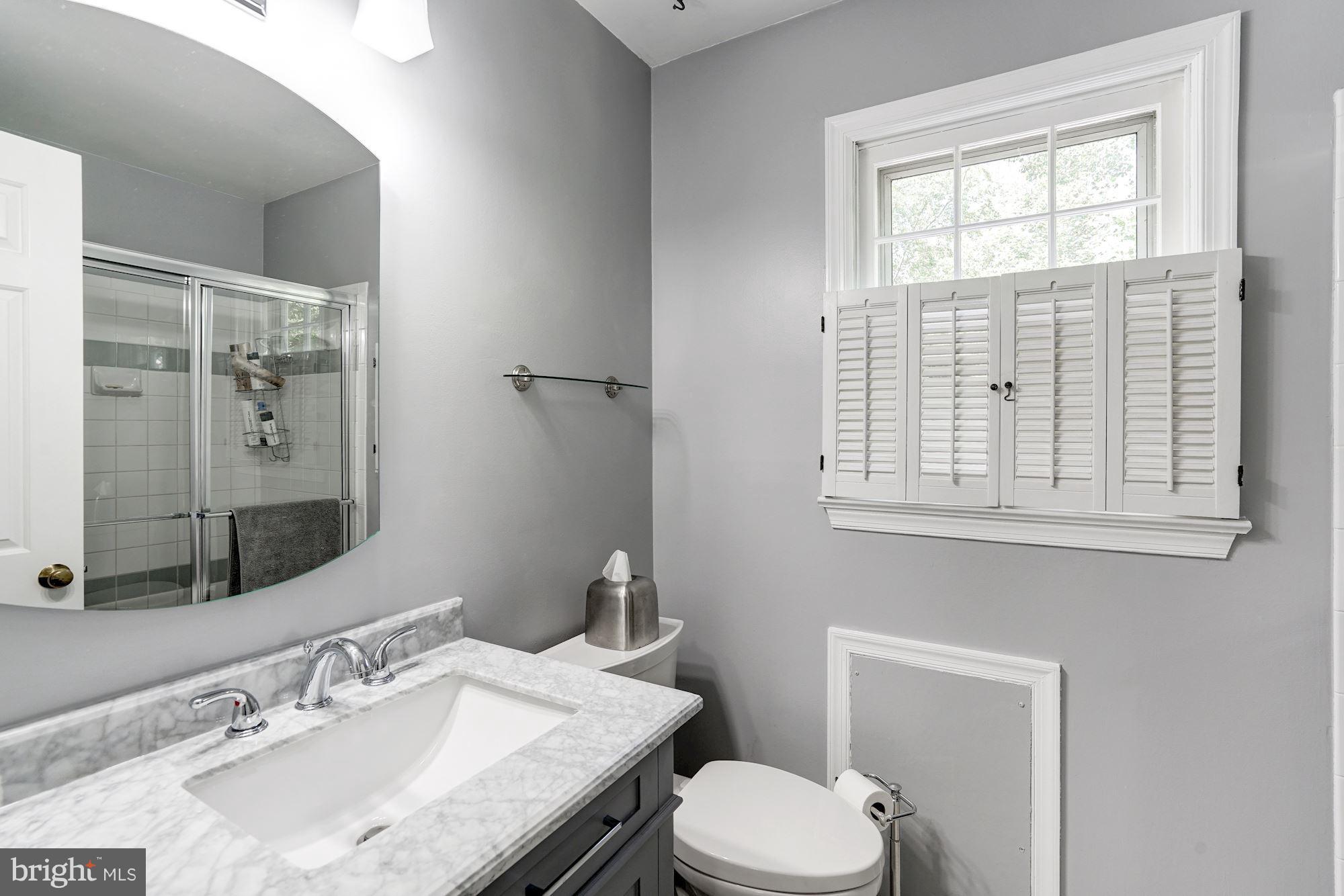 2104 Salt Kettle Way Reston, VA 20191 - Photo 14 of 29 a bathroom with a granite countertop toilet sink and mirror