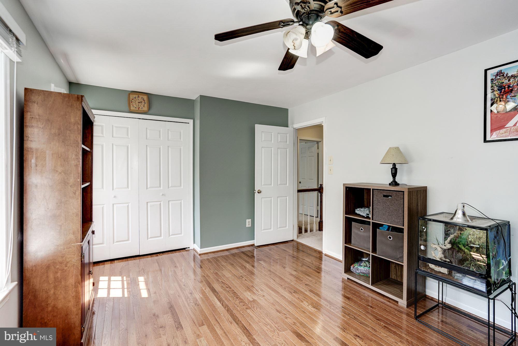 2104 Salt Kettle Way Reston, VA 20191 - Photo 16 of 29 a view of a livingroom with furniture and a ceiling fan
