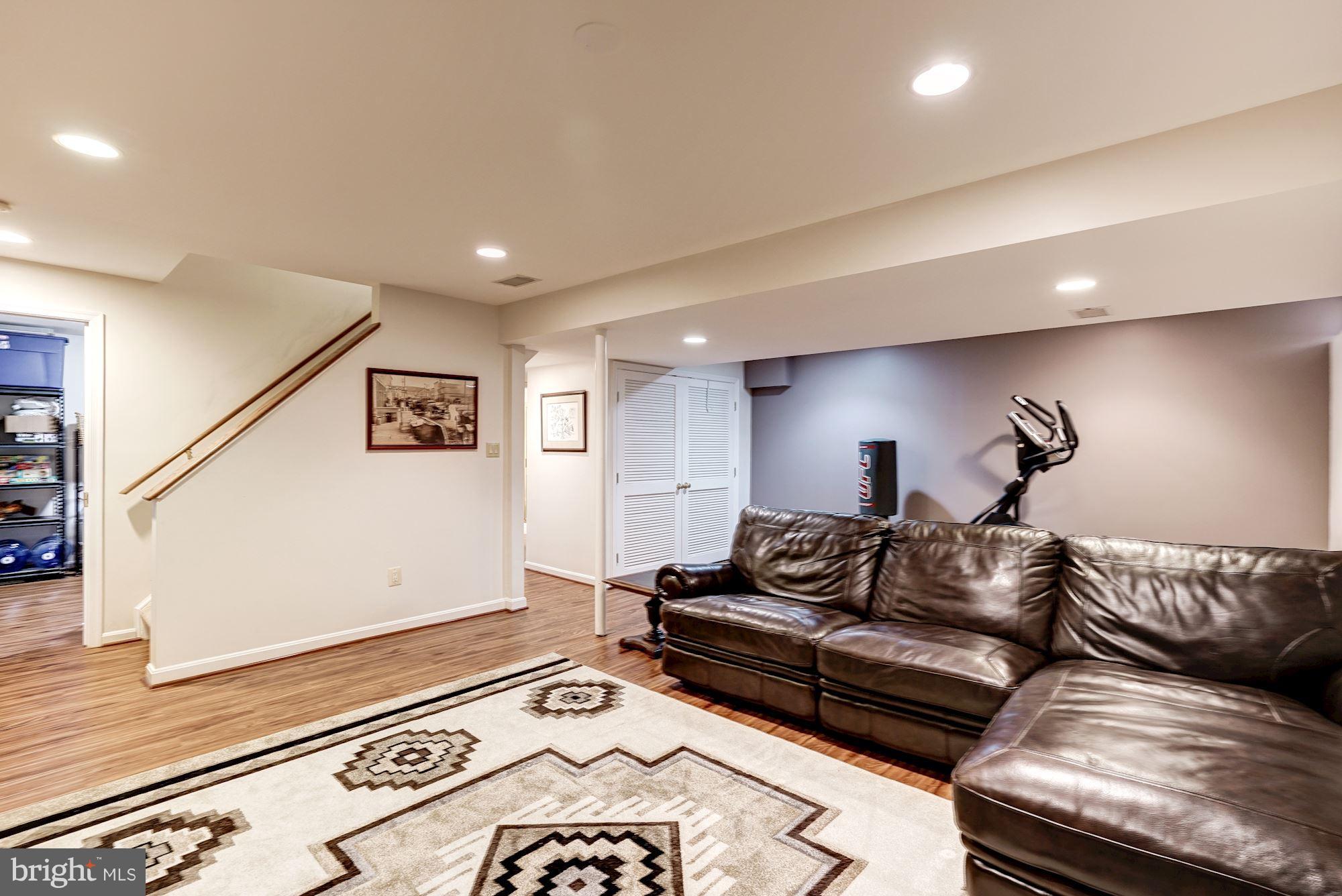 2104 Salt Kettle Way Reston, VA 20191 - Photo 19 of 29 a living room with furniture and a rug