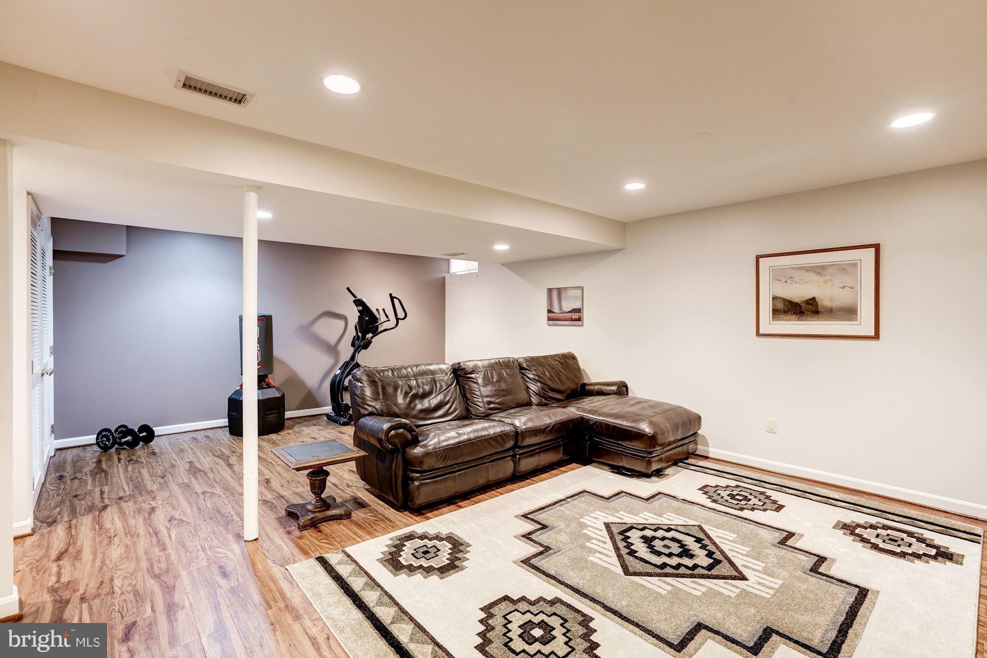 2104 Salt Kettle Way Reston, VA 20191 - Photo 21 of 29 a living room with furniture and a wooden floor